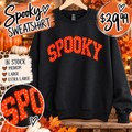 Orange Spooky sweatshirt with white polka-dot lettering